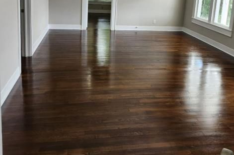 a kitchen under construction with blue tape on the floor .