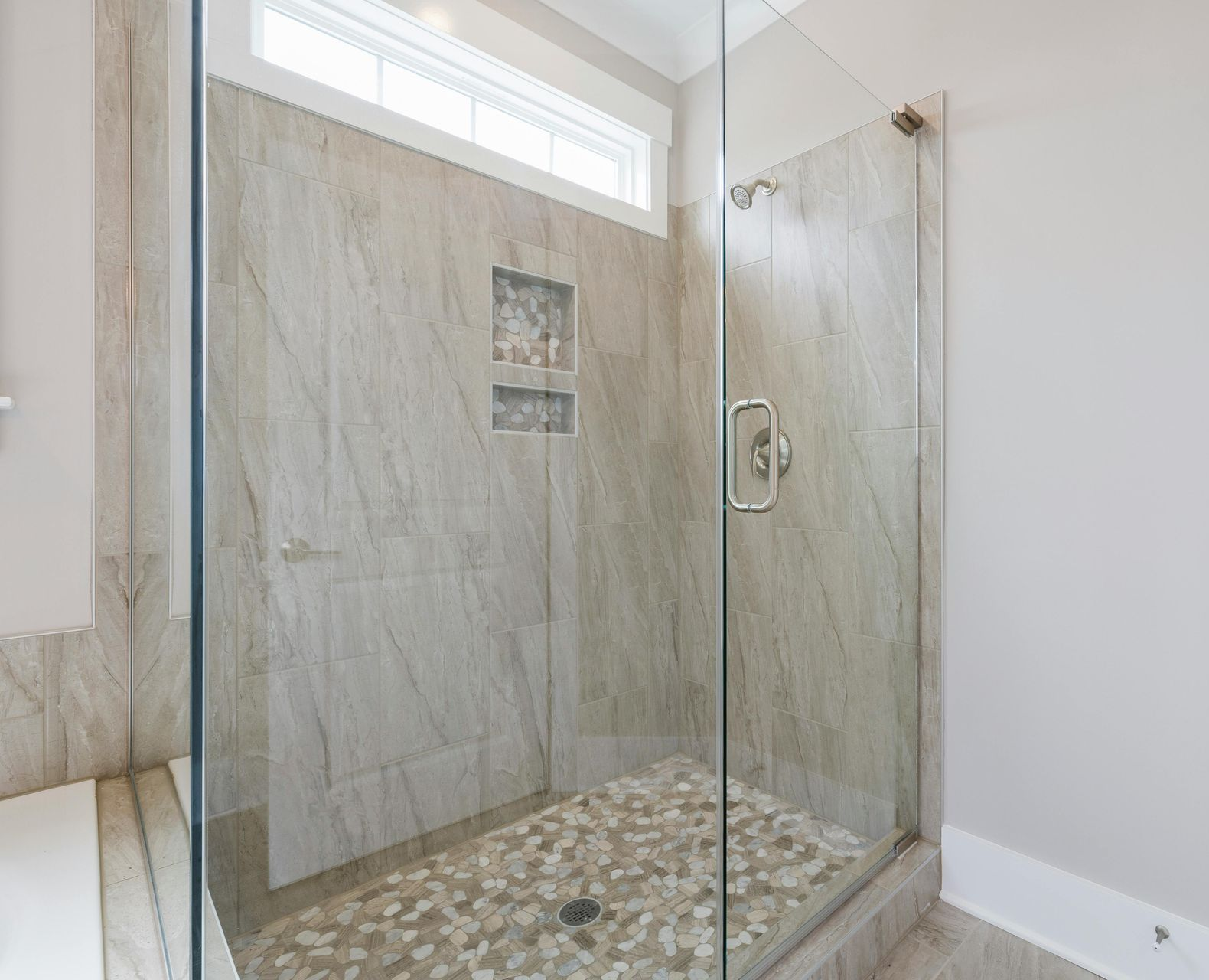 a kitchen under construction with blue tape on the floor .
