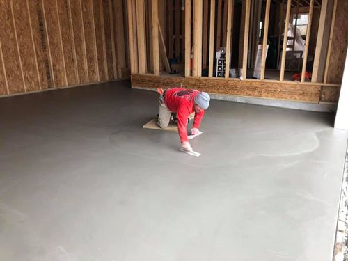 Concrete Foundation Installation —  Man Installing Concrete Floor in St. Louis, MO