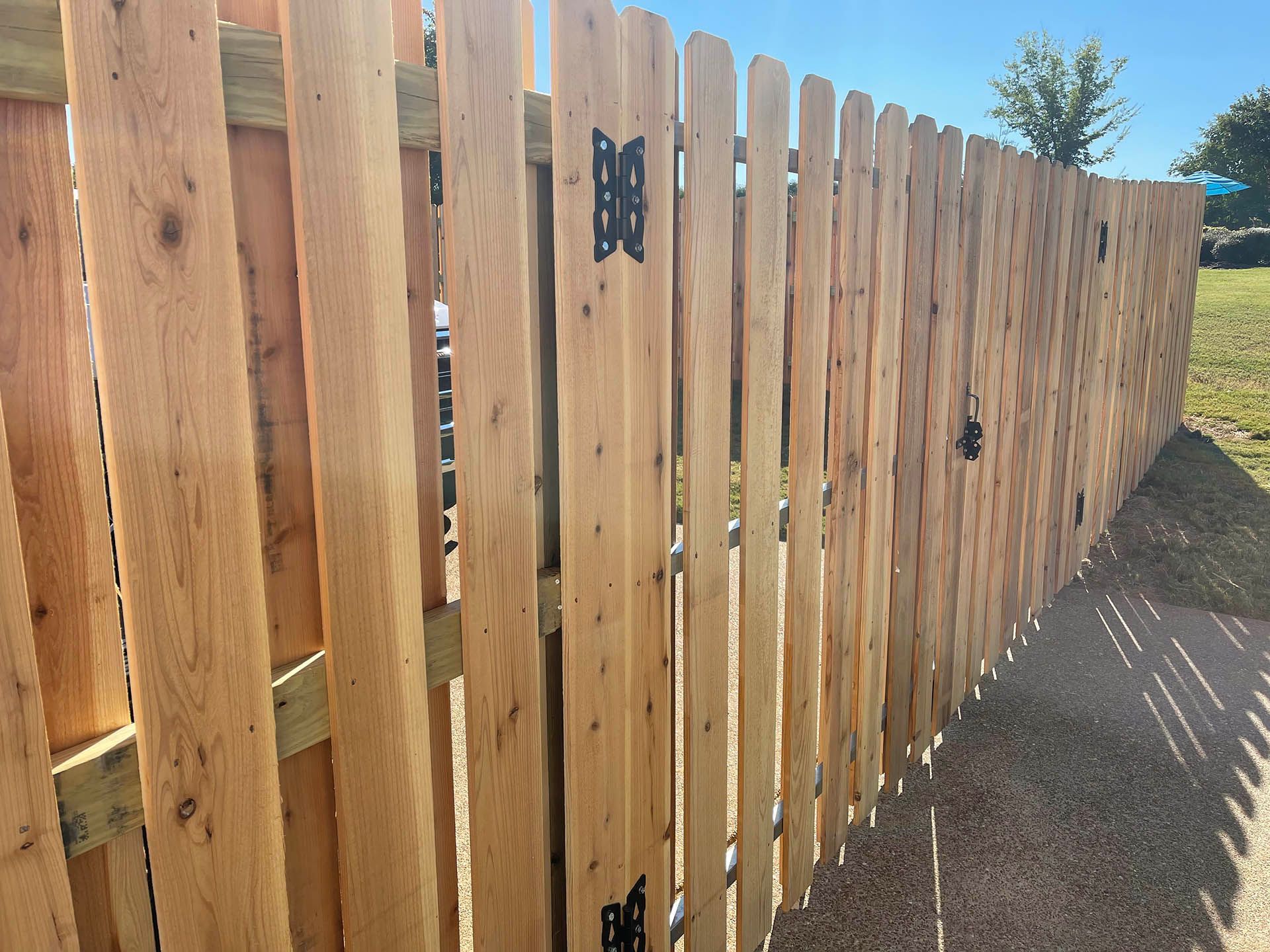 Wood installation in Belmont, North Carolina featuring tall wood panels for classic style, lasting privacy, and natural curb appeal in residential spaces.