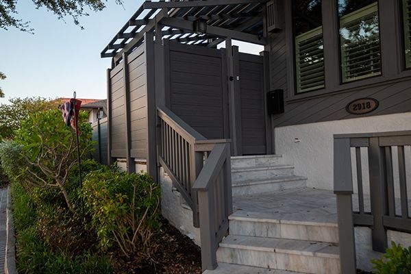 A house with stairs leading up to the front door