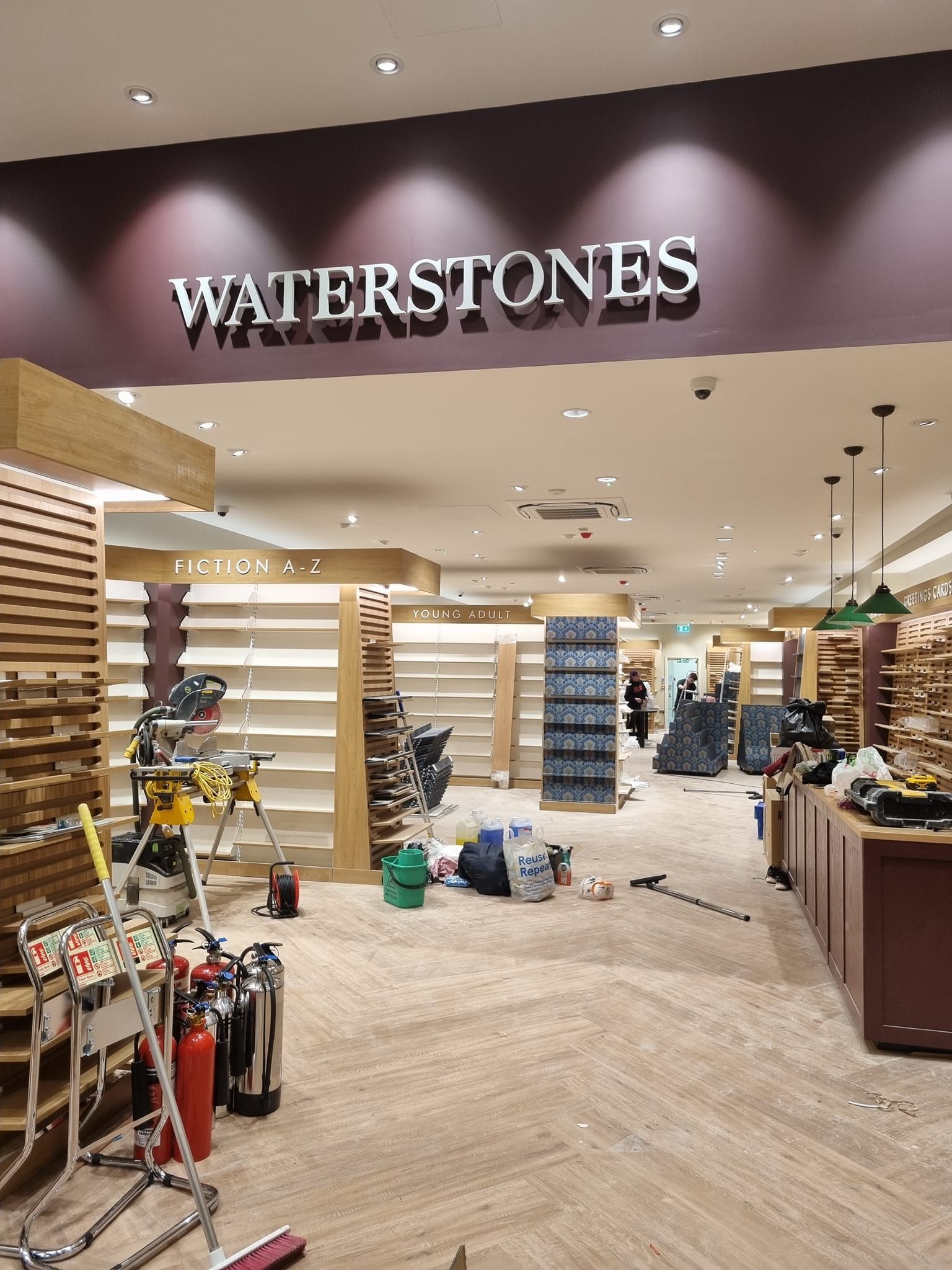 A large room with a sign that says waterstones on it.