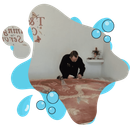 A man is cleaning a rug in a room with bubbles around him