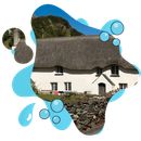 A white house with a thatched roof is surrounded by blue bubbles