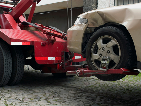 silver car being towed