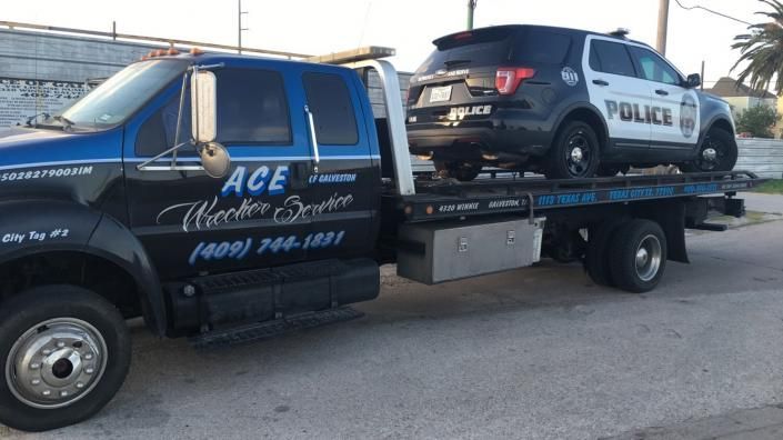 police car on tow truck