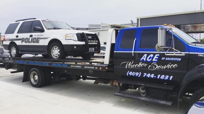 police car on tow truck