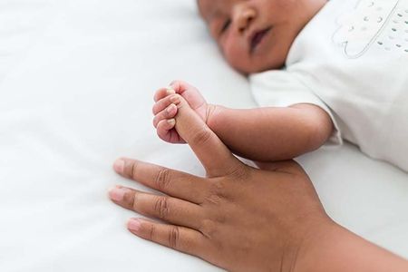 infant baby holding hand