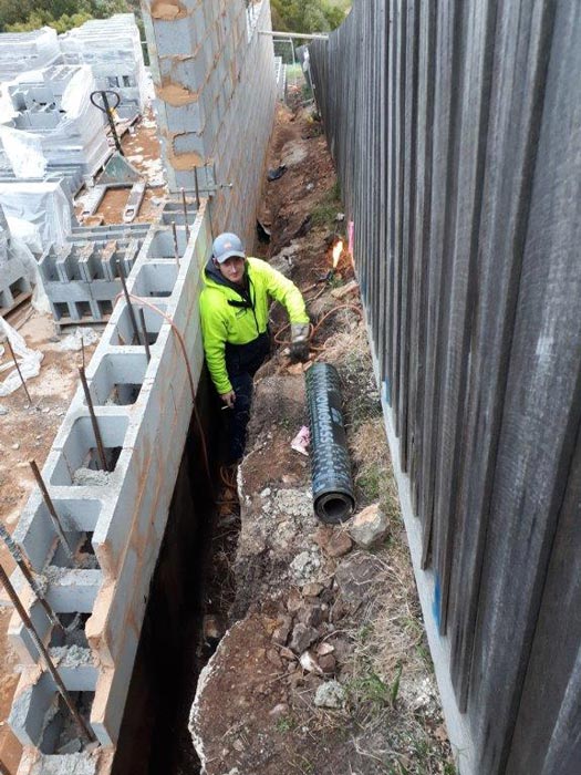 man walking between two walls