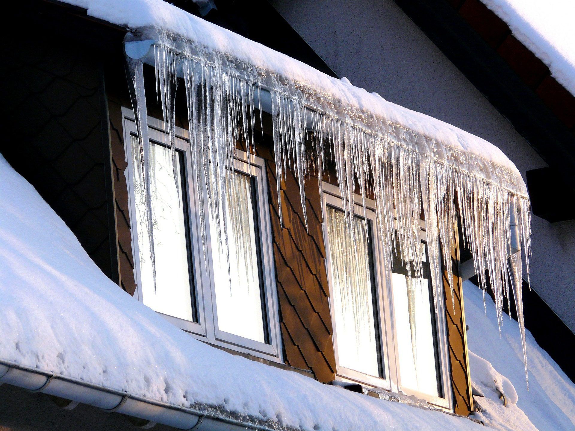 Icicles hanging from the roof of a house
