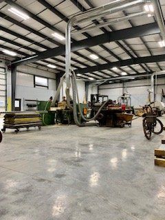 A large warehouse with a lot of machinery in it.