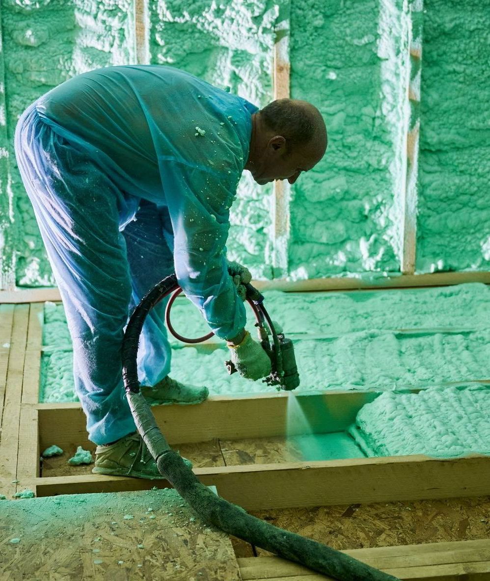 Spray Foam Insulation Contractor in Flathead Valley spraying foam into attic floor