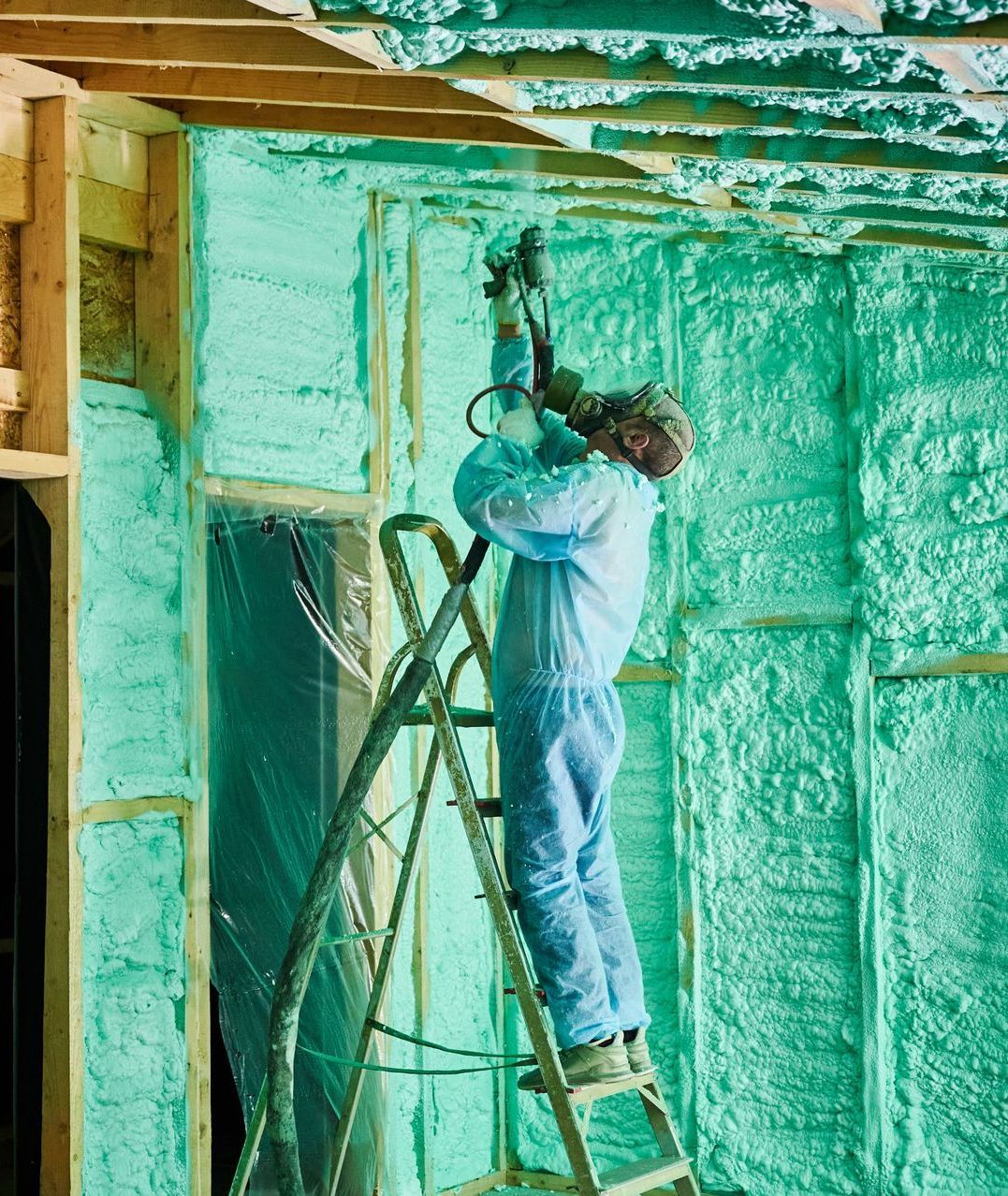 Spray  Foam Insulation Contractor spraying insulation into attic in Kalispell MT