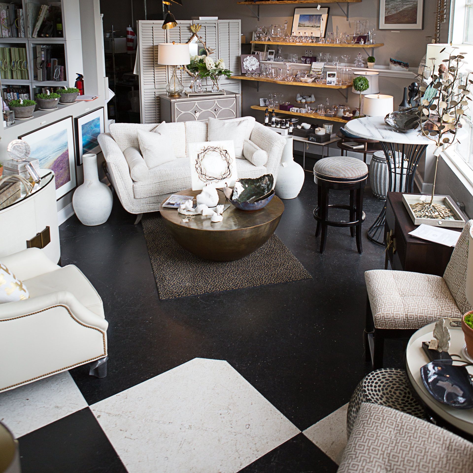 A living room filled with furniture and a checkered floor