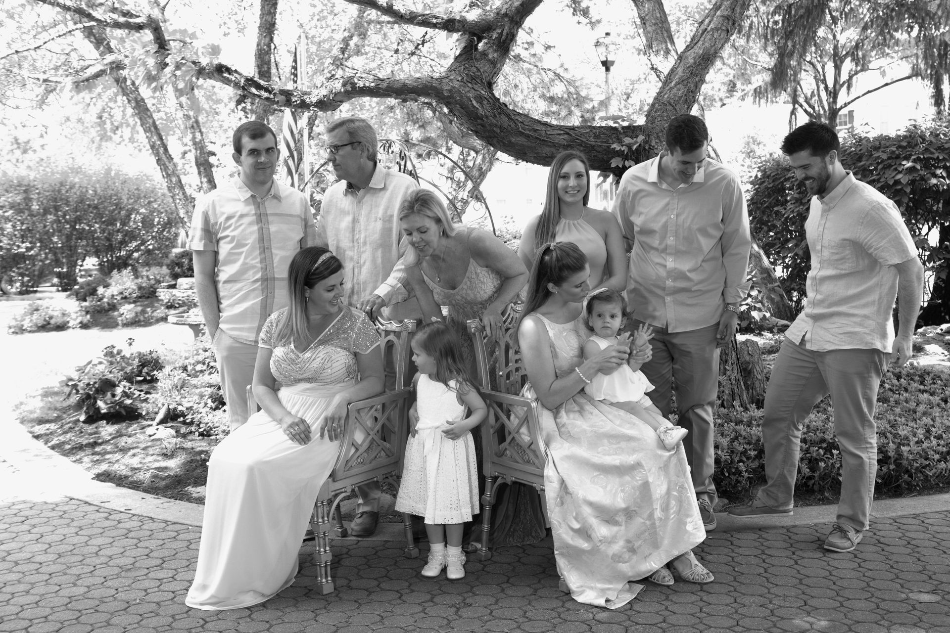 A black and white photo of a group of people posing for a picture.