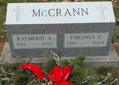 Tombstone of Raymond A. McCRANN (1918-1959) and Virginia E. McCRANN (1919-2014), with a Christmas wreath.