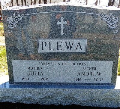 Gravestone for the Plewa family: Julia (1921-2015) and Andrew (1916-2003). Features a cross and floral designs.