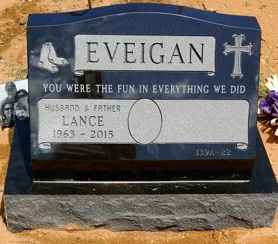 Headstone of Lance Eveigan, black granite, with the Red Sox logo, cross, and an inscription.