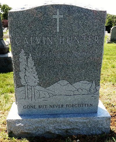 Gray granite headstone with the name 