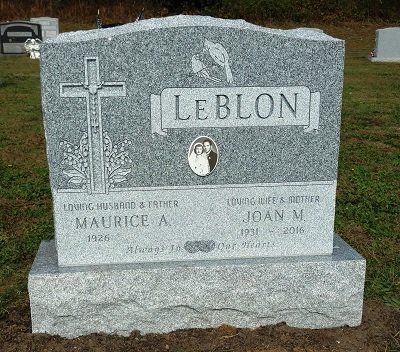 Gray granite headstone for Maurice A. and Joan M. Leblon, with cross, photo, and dates of birth and death.