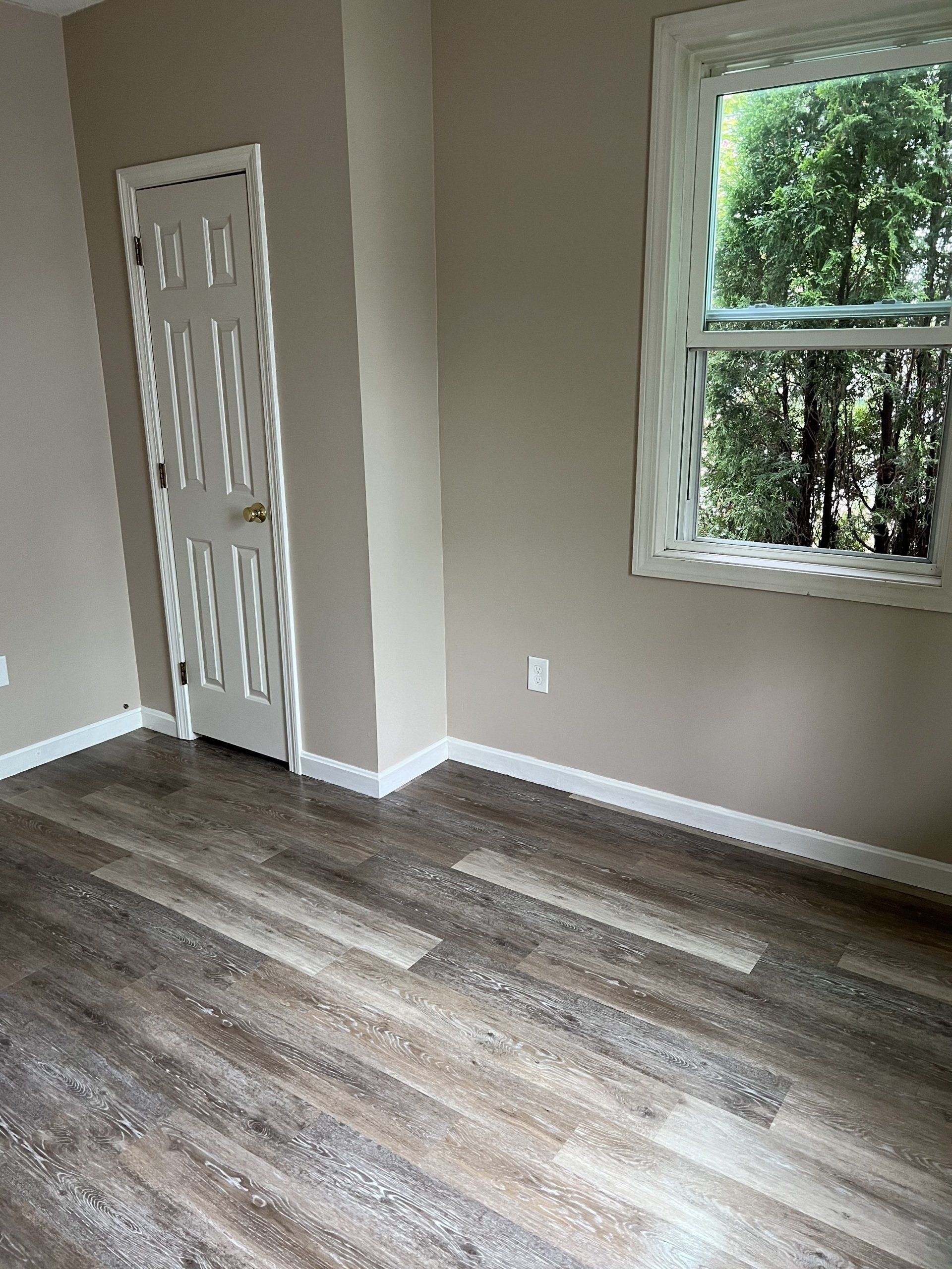 8 Church St. - Living room with grey flooring