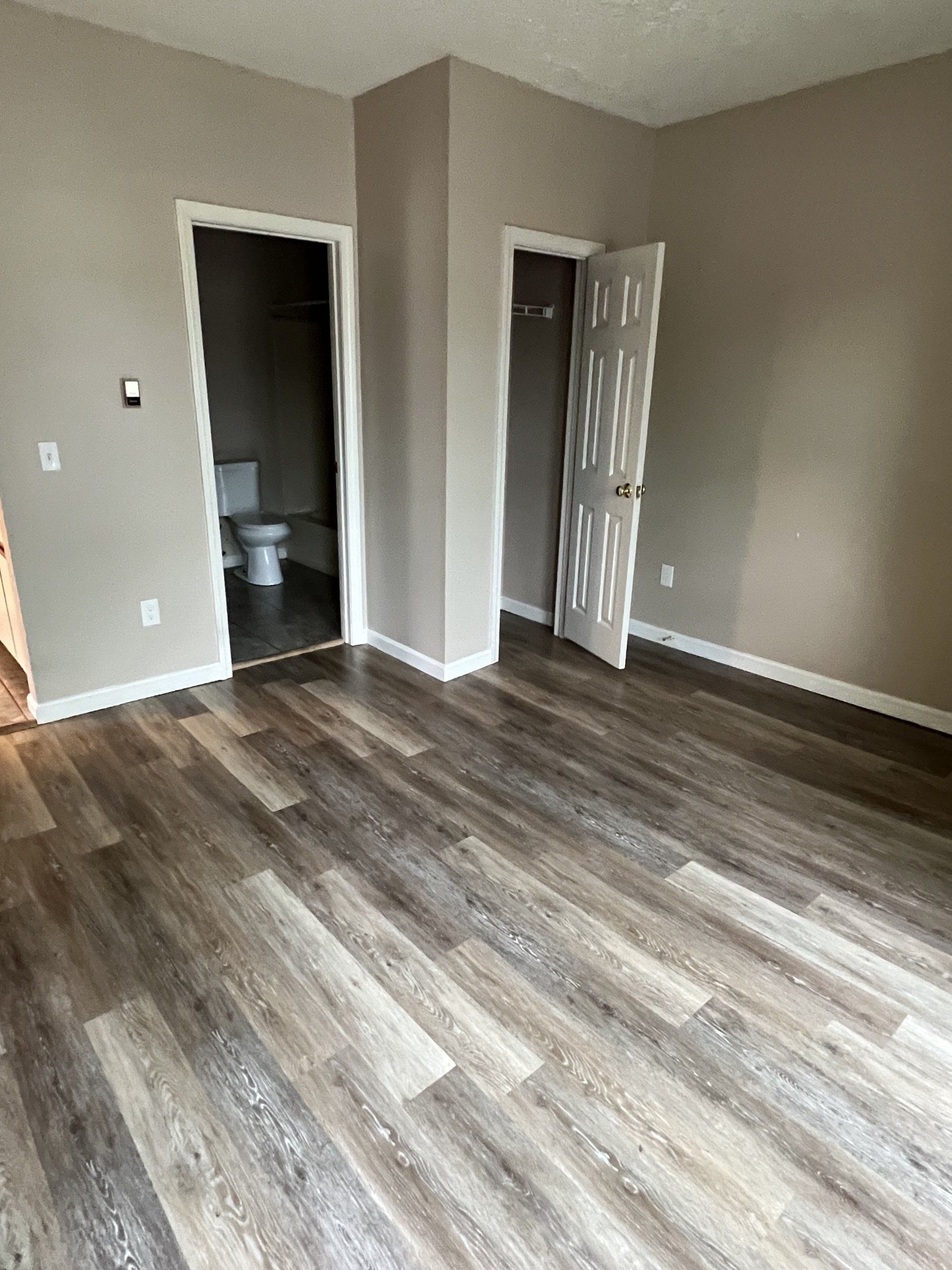 8 Church St. - bedroom with grey flooring and closet