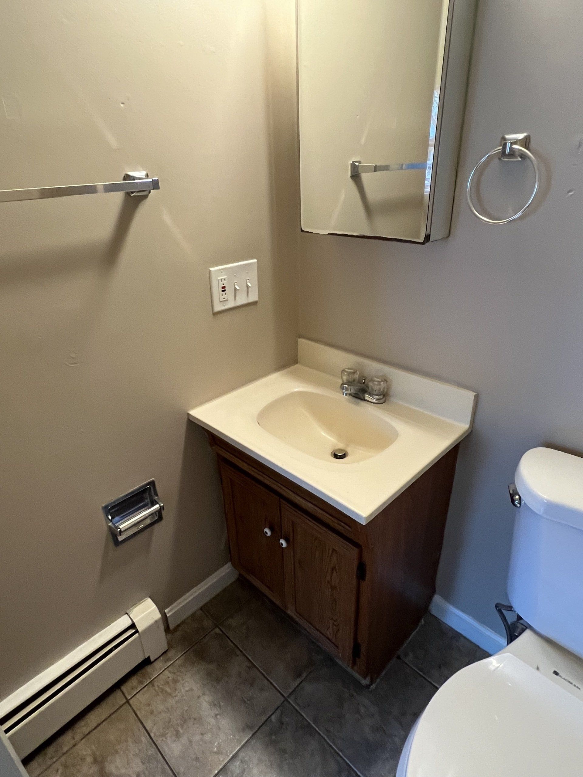 8 Church St. - bathroom sink and medicine cabinet with mirror