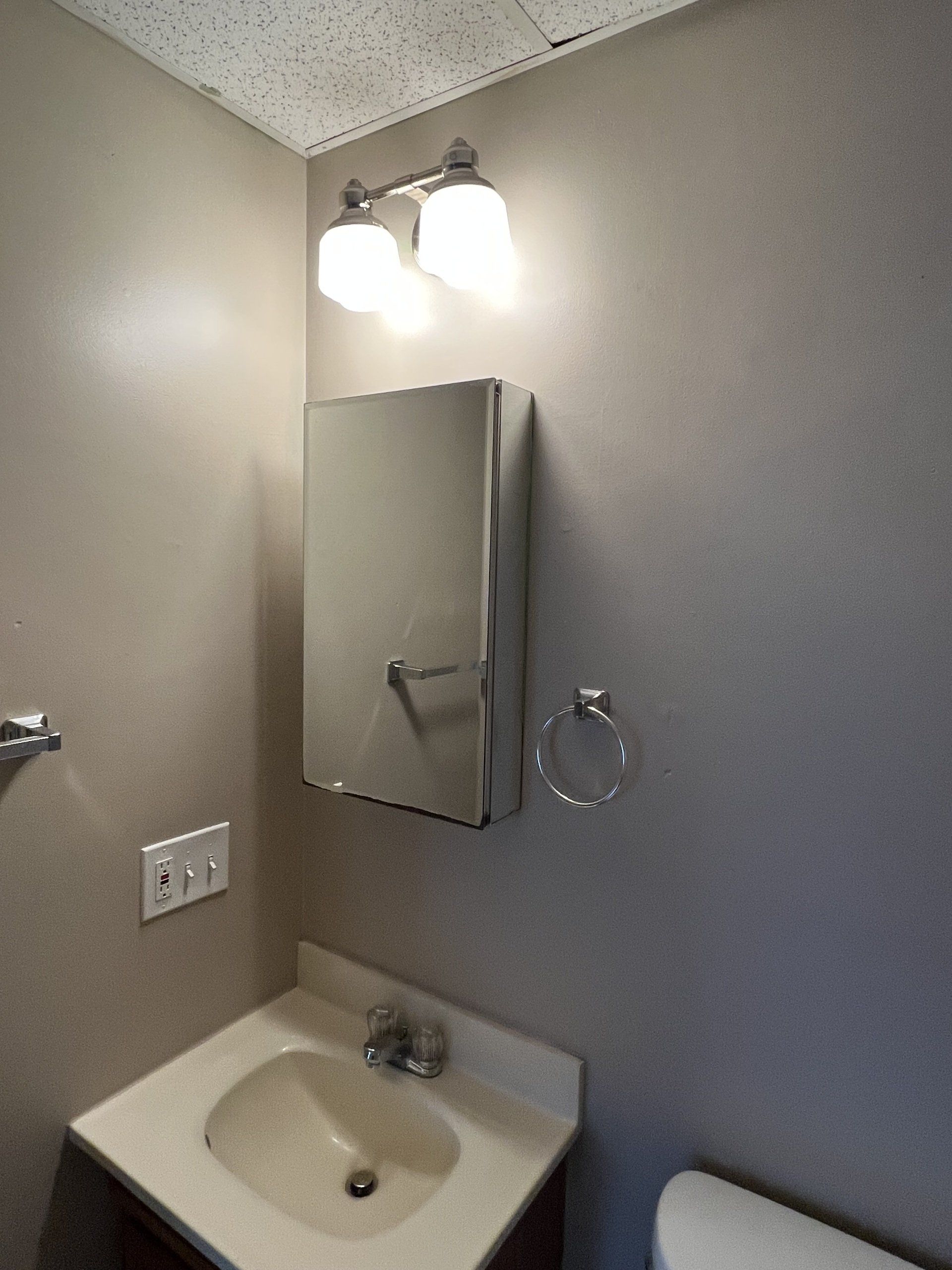 8 Church St. - bathroom sink and medicine cabinet with mirror