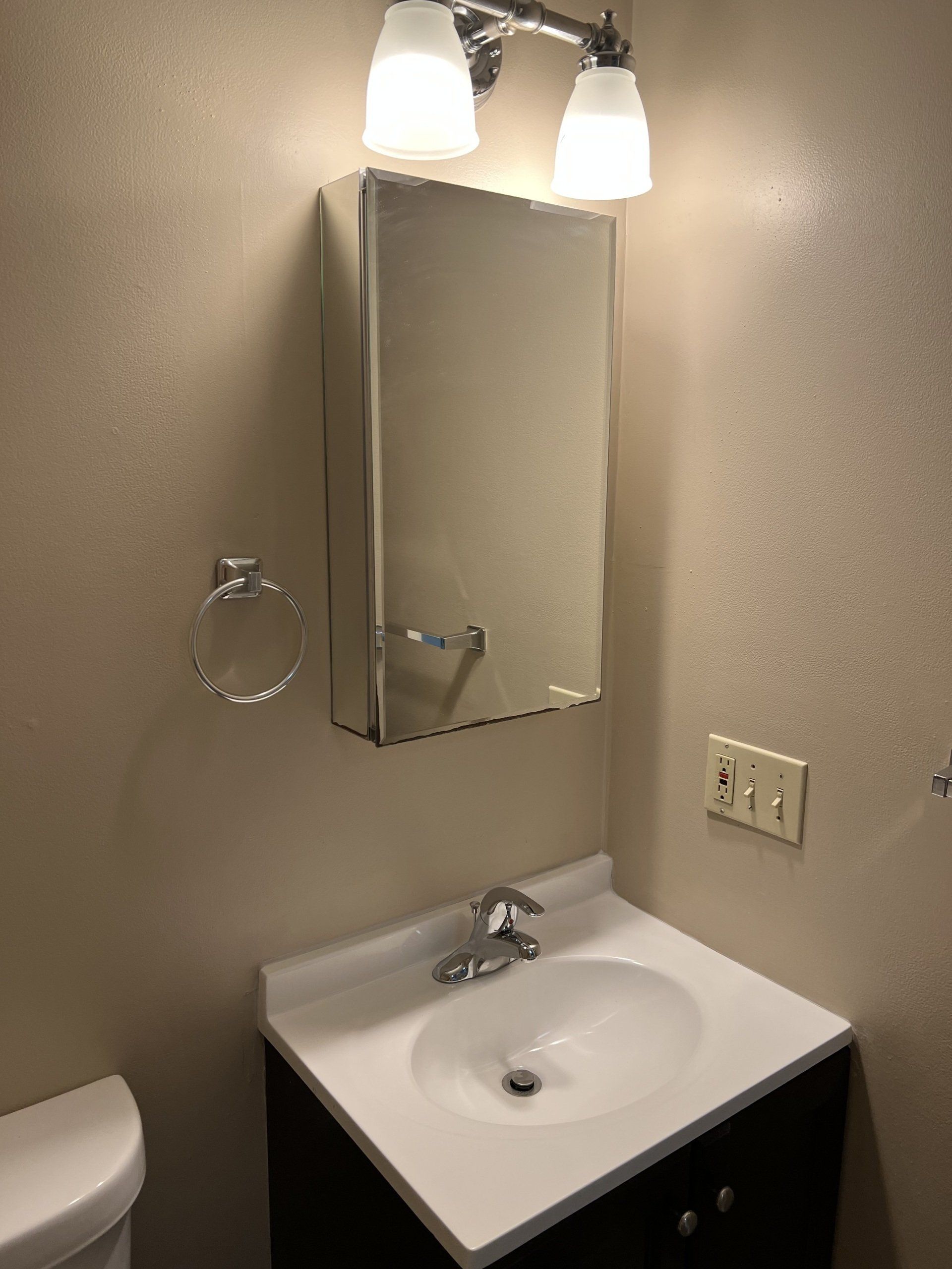 8c Church St. - bathroom with sink with cabinets and medicine cabinet with mirror