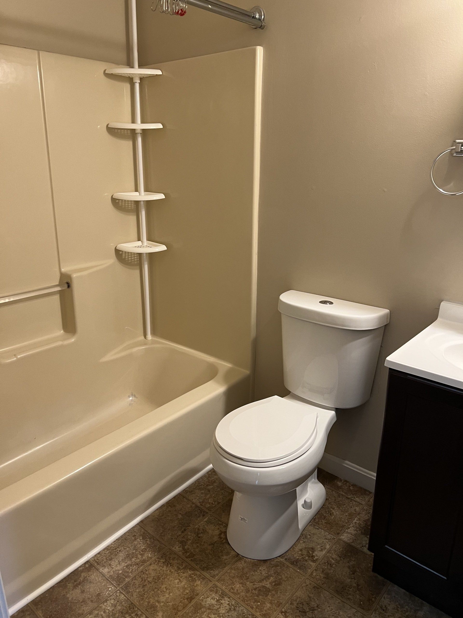 8c Church St. - bathroom with shower, tub, toilet, and sink with cabinets
