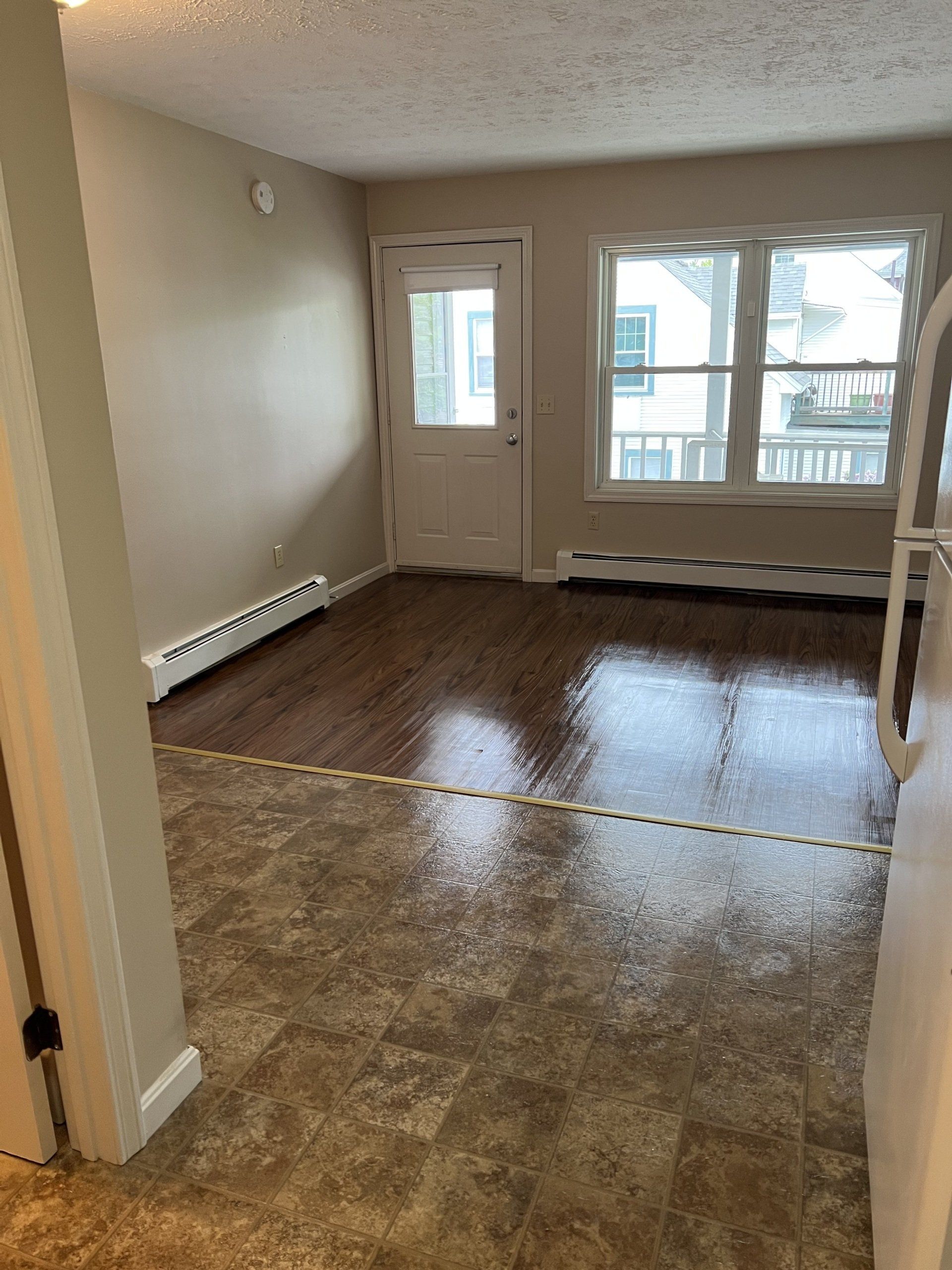 8c Church St. - Living room with windows