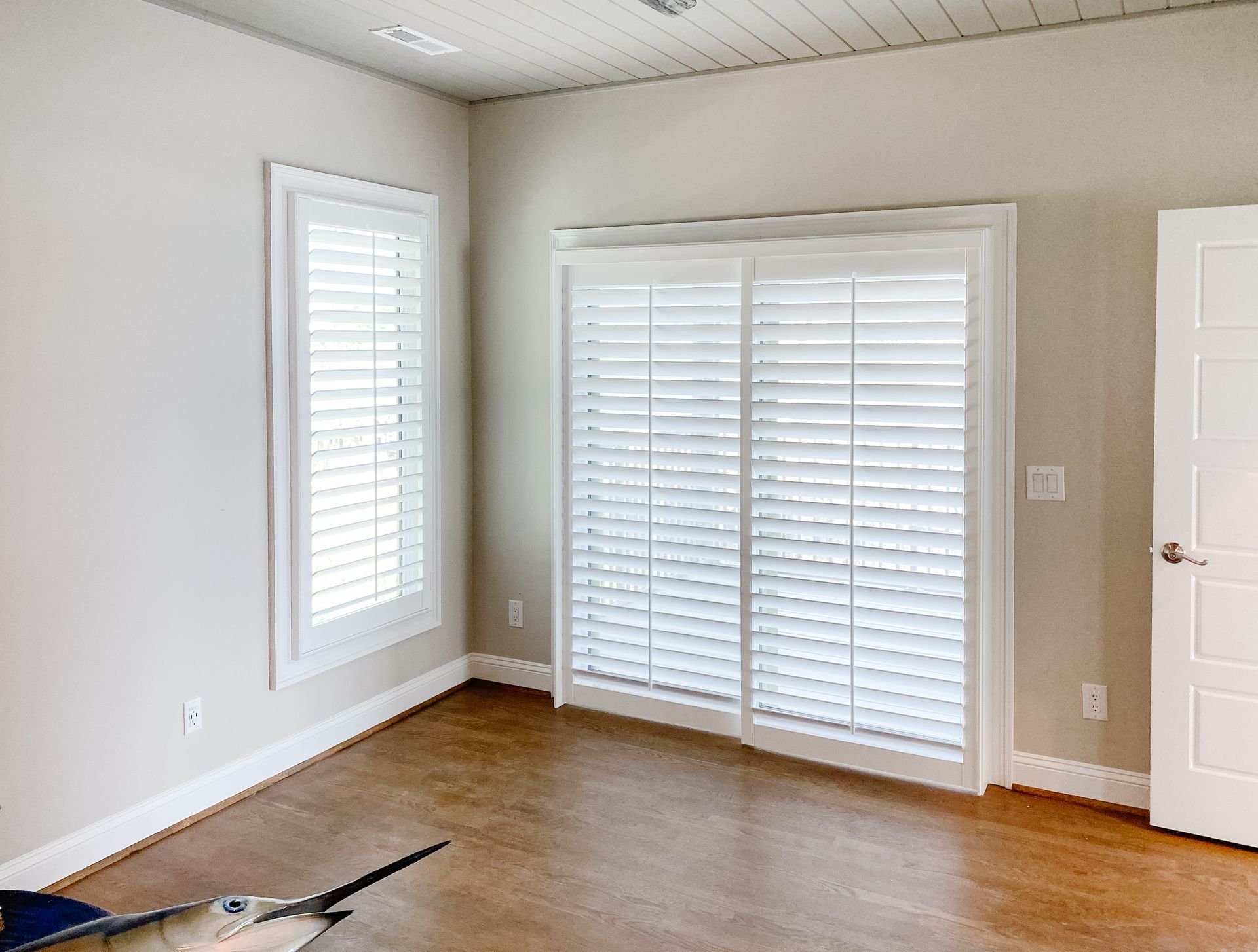 Sliding track shutter in a bedroom in Charlotte