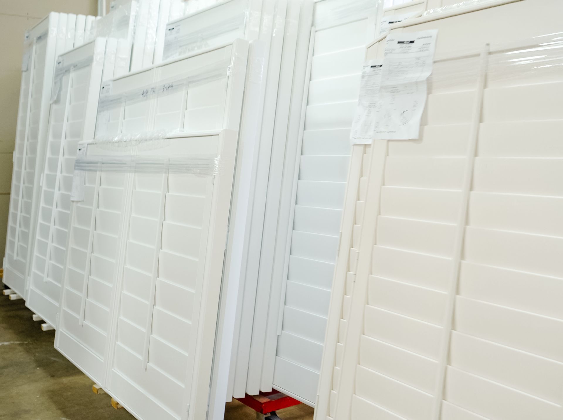 Custom manufactured shutters staged in a warehouse