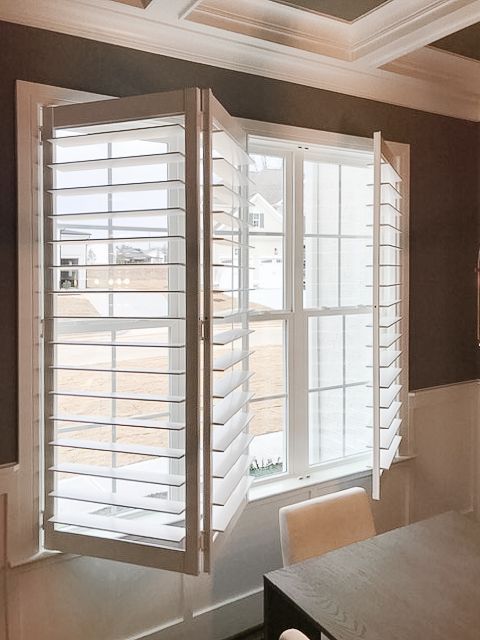 Bifold plantation shutter opening with 2 panels to the left and 1 panel to the right
