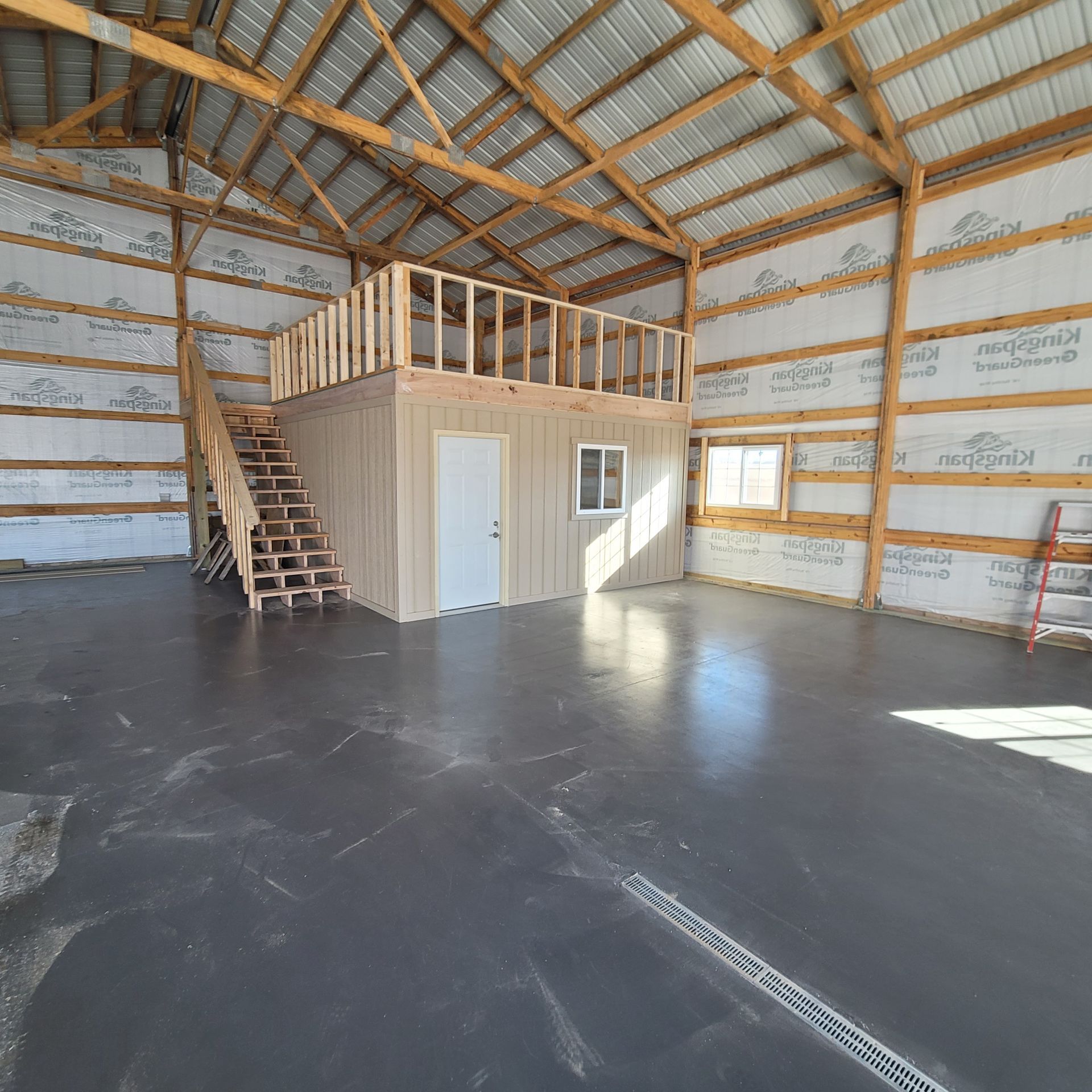 There is a staircase leading up to the second floor of the building.