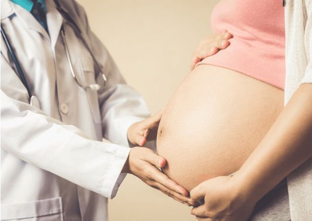 Stethoscope on expecting mother's stomach