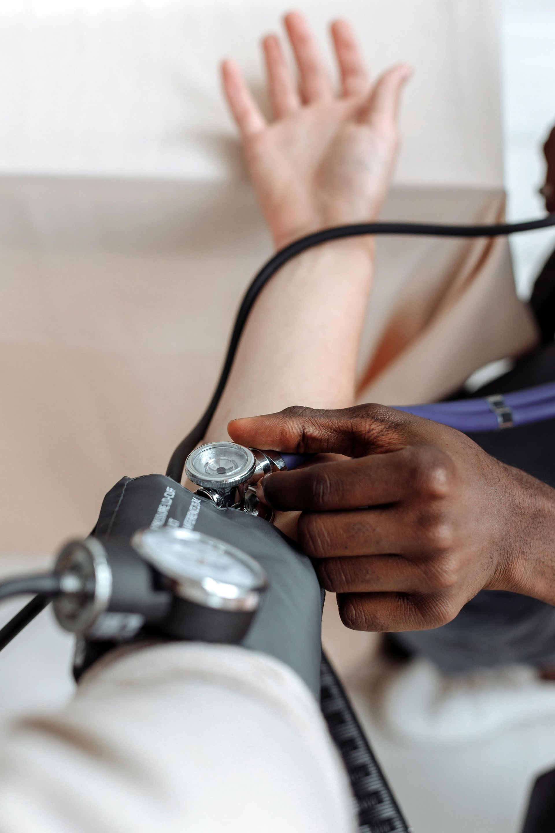 Doctor taking blood pressure