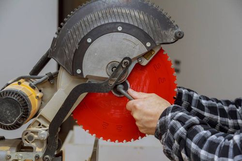 man installing a new cutter blade