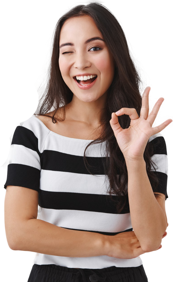A woman in a striped shirt is giving an ok sign.