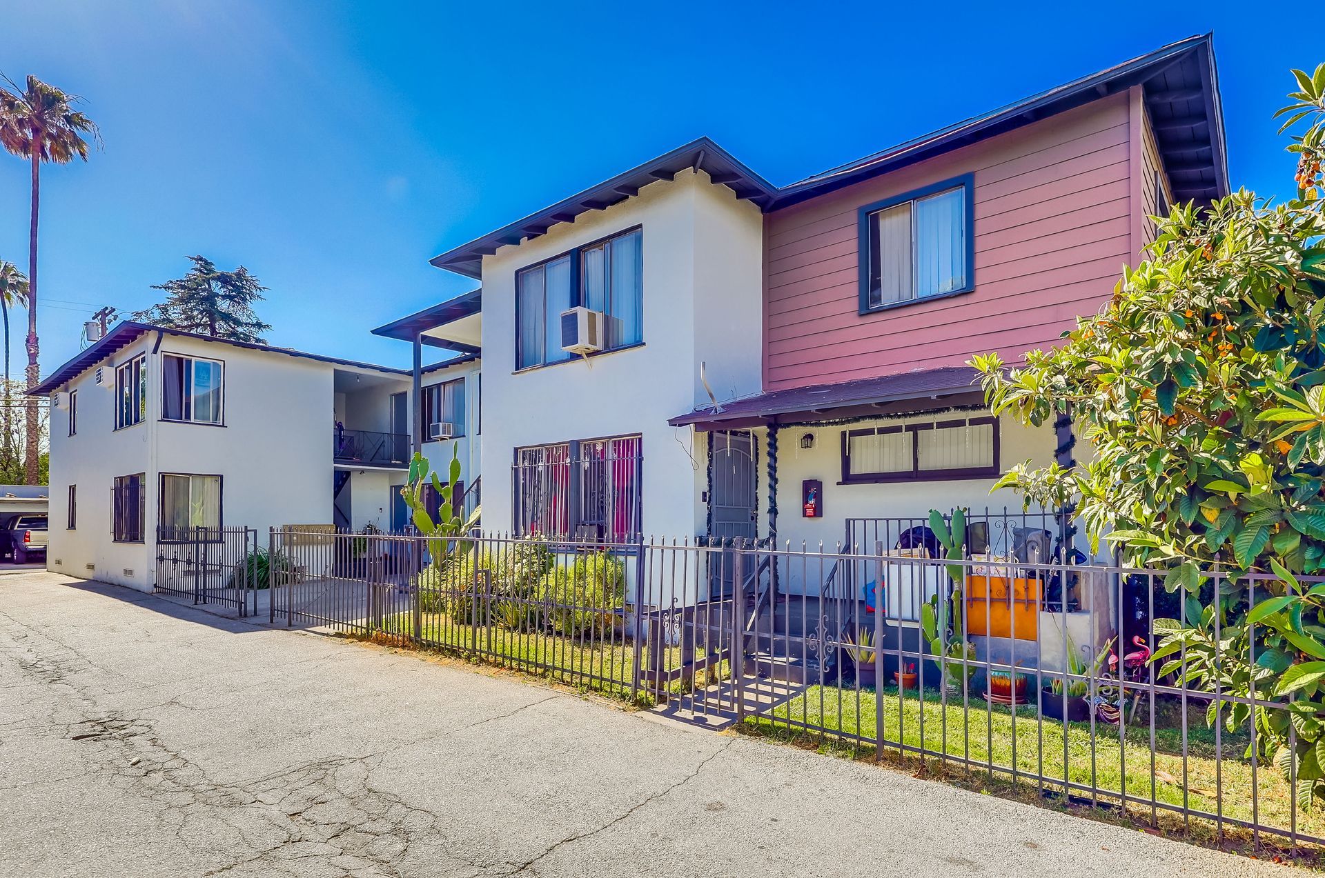A couple of houses sitting next to each other on a sunny day.