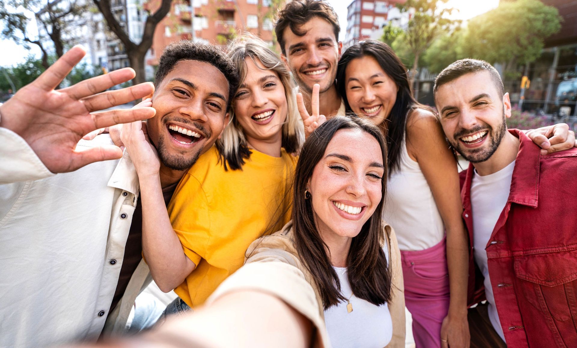 A group of young people are taking a selfie together.