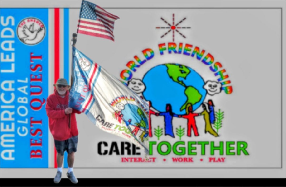 A man holding a flag in front of a sign that says world friendships