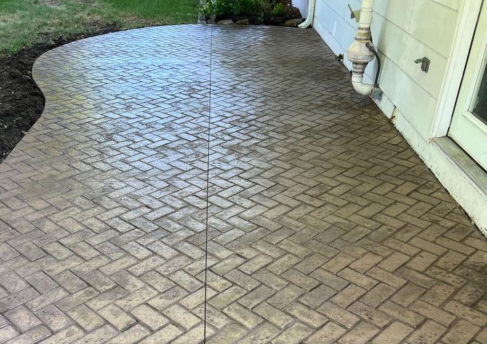 Concrete Patio next to a Lawn – Moline, IL –  QCFI Concrete & Masonry