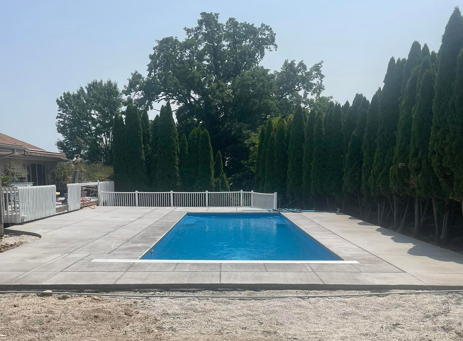 Concrete Deck on Swimming Pool – Moline, IL –  QCFI Concrete & Masonry