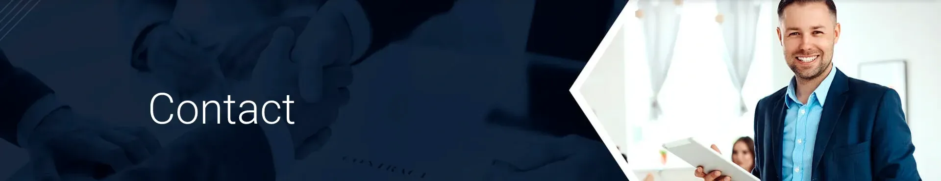 A man in a suit is standing in front of a sign that says contact.