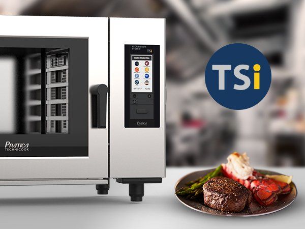 A plate of food next to a tsi oven