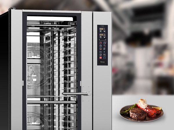 A stainless steel oven with a plate of food in front of it.