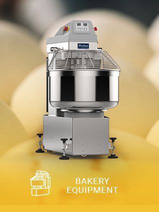 A bakery equipment machine is sitting in front of a bunch of eggs.