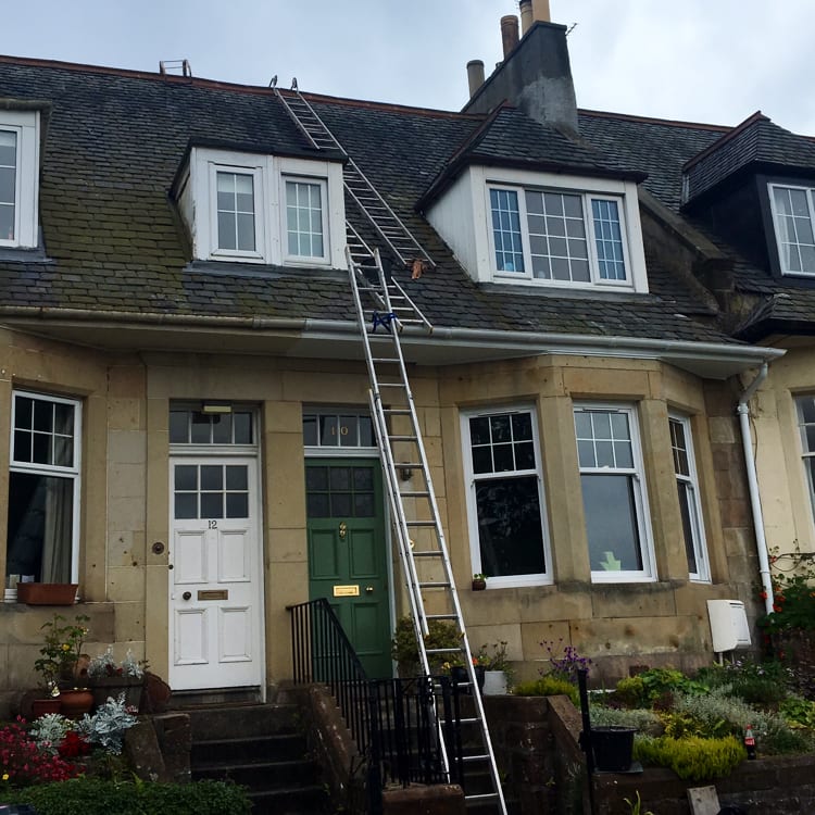 Ladders set against a 2-storey property