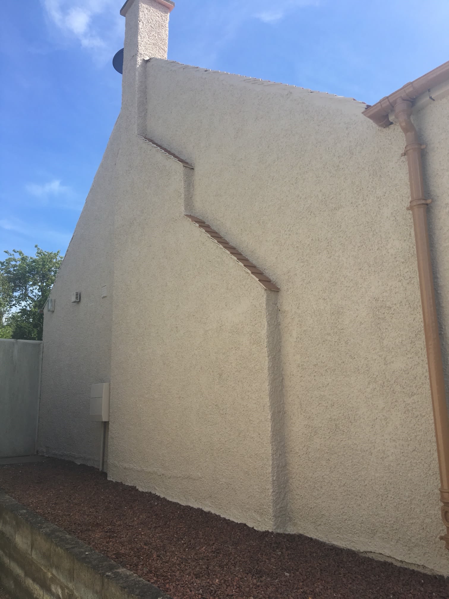 Large white pebble dashed house